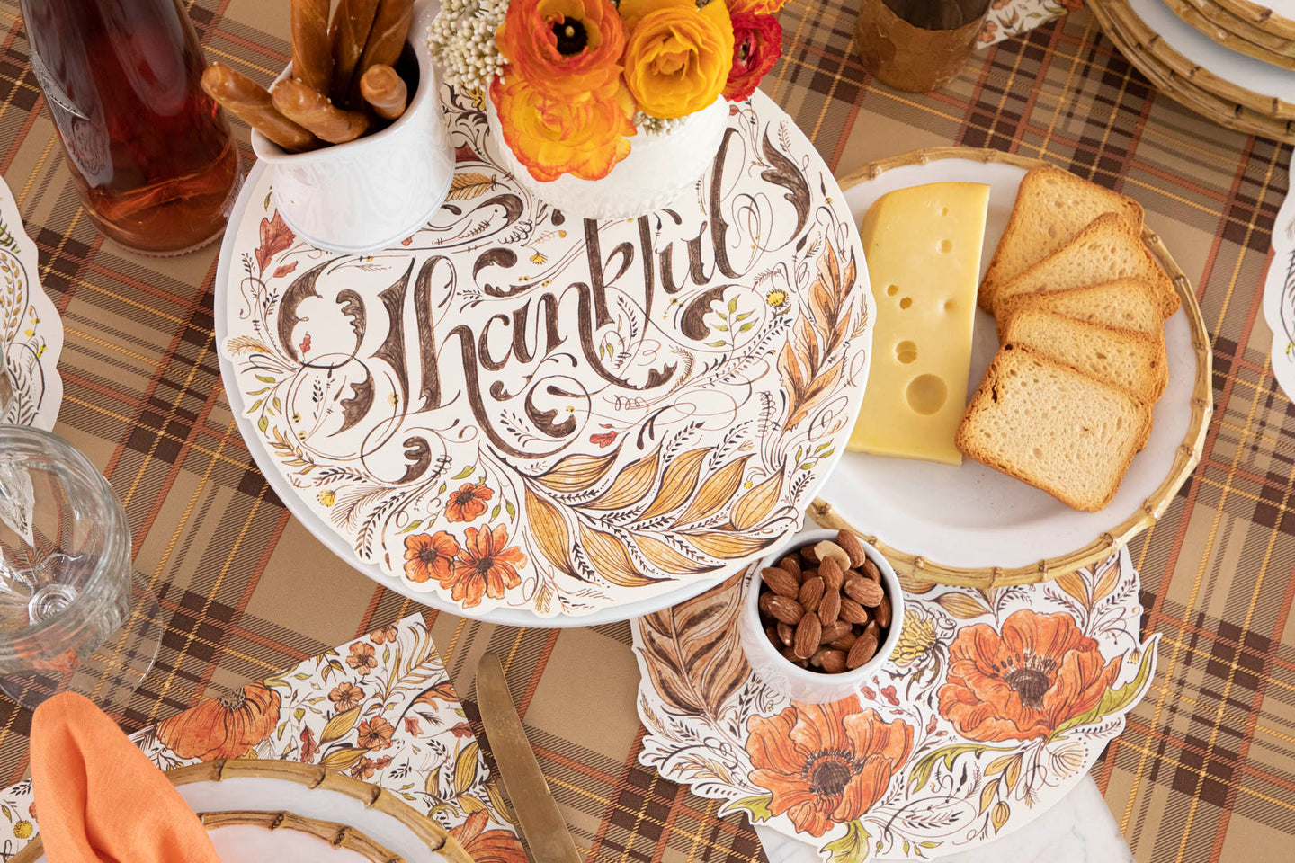 A spring table with Pink Bow Serving Papers with plates of treats atop.