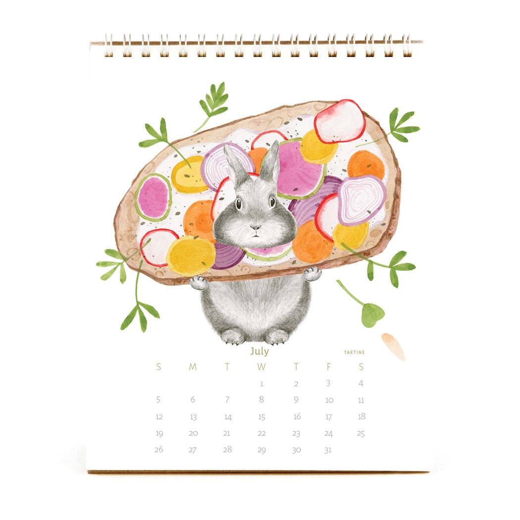 2026 Dear Hancock Bunny Calendar featuring a bunny holding toast with vegetables on it.