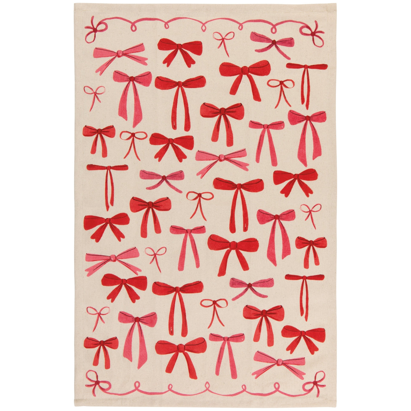 A tea towel with a beige background and illustration of various colors and styles of red bows printed all over it. 