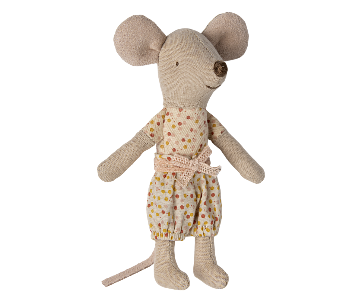 Stuffed toy mouse wearing a polka dot outfit on a white background.