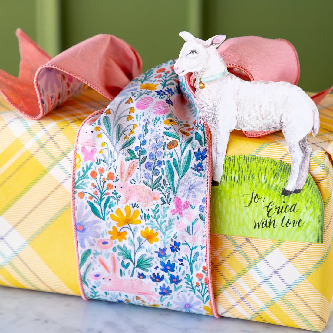 Poplin Watercolor Floral Bunny Ribbon tied around a wrapped gift.