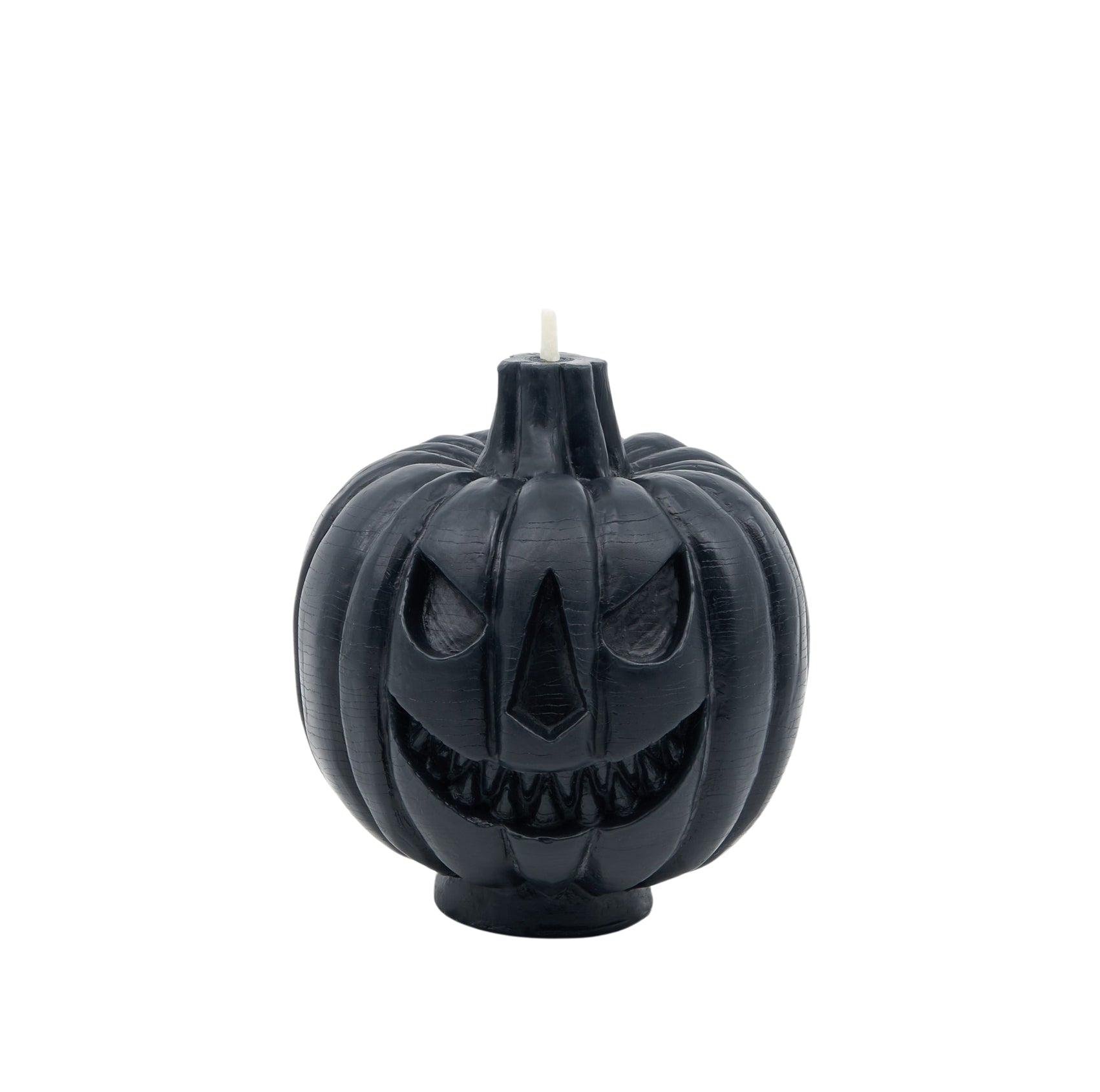The scary face of a black jack-o-lantern candle.