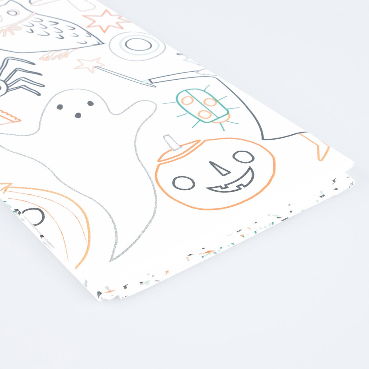 Coloring tablecloth with Halloween-themed illustrations on a white background.