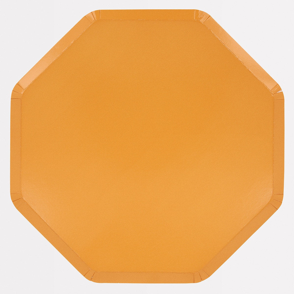 Octagonal yellow paper plate on a white background.