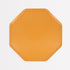 Octagonal yellow paper plate on a white background. 