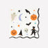 Halloween-themed paper napkin illustrated with ghosts, pumpkins, cats, and stars on a white background. 