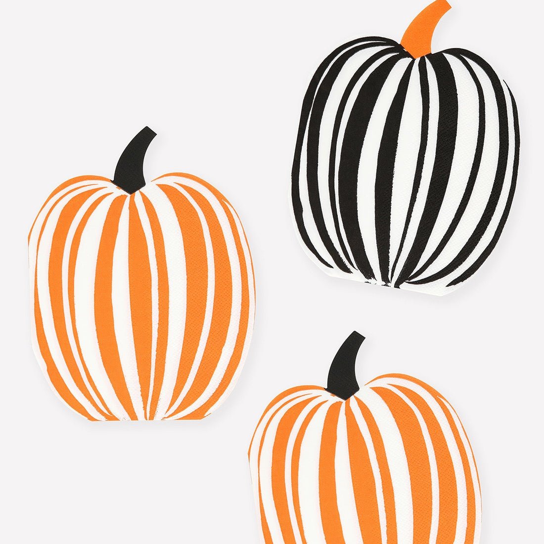 Three pumpkin napkins.  Two orange and white striped and one black and white striped on a white background. 