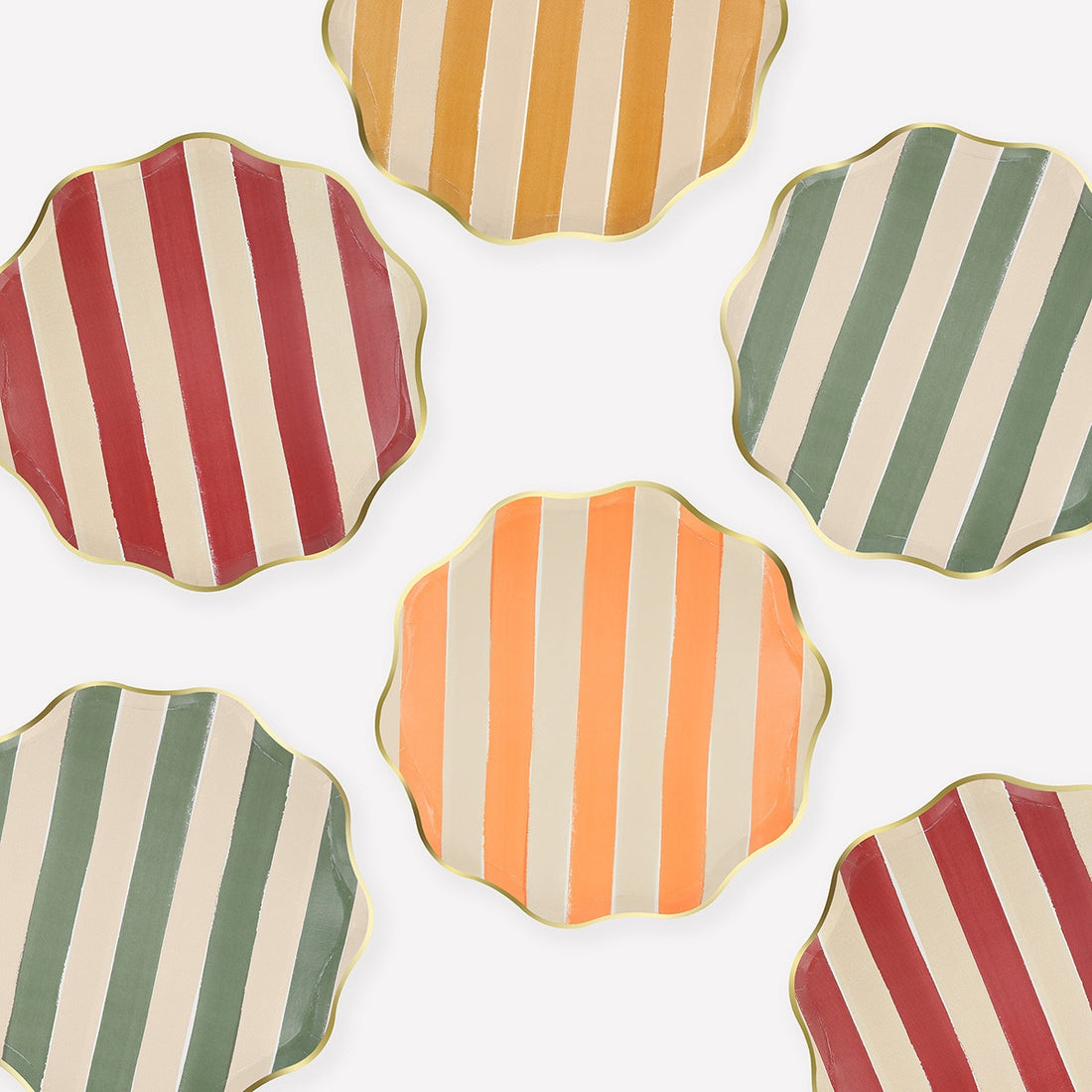 Round plates with wavy edges and fall colored striped patterns on a white background.