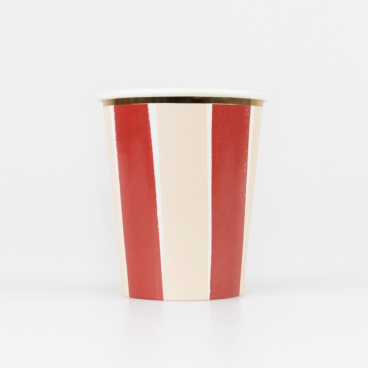 Red and white striped paper cup with gold rim on a white background