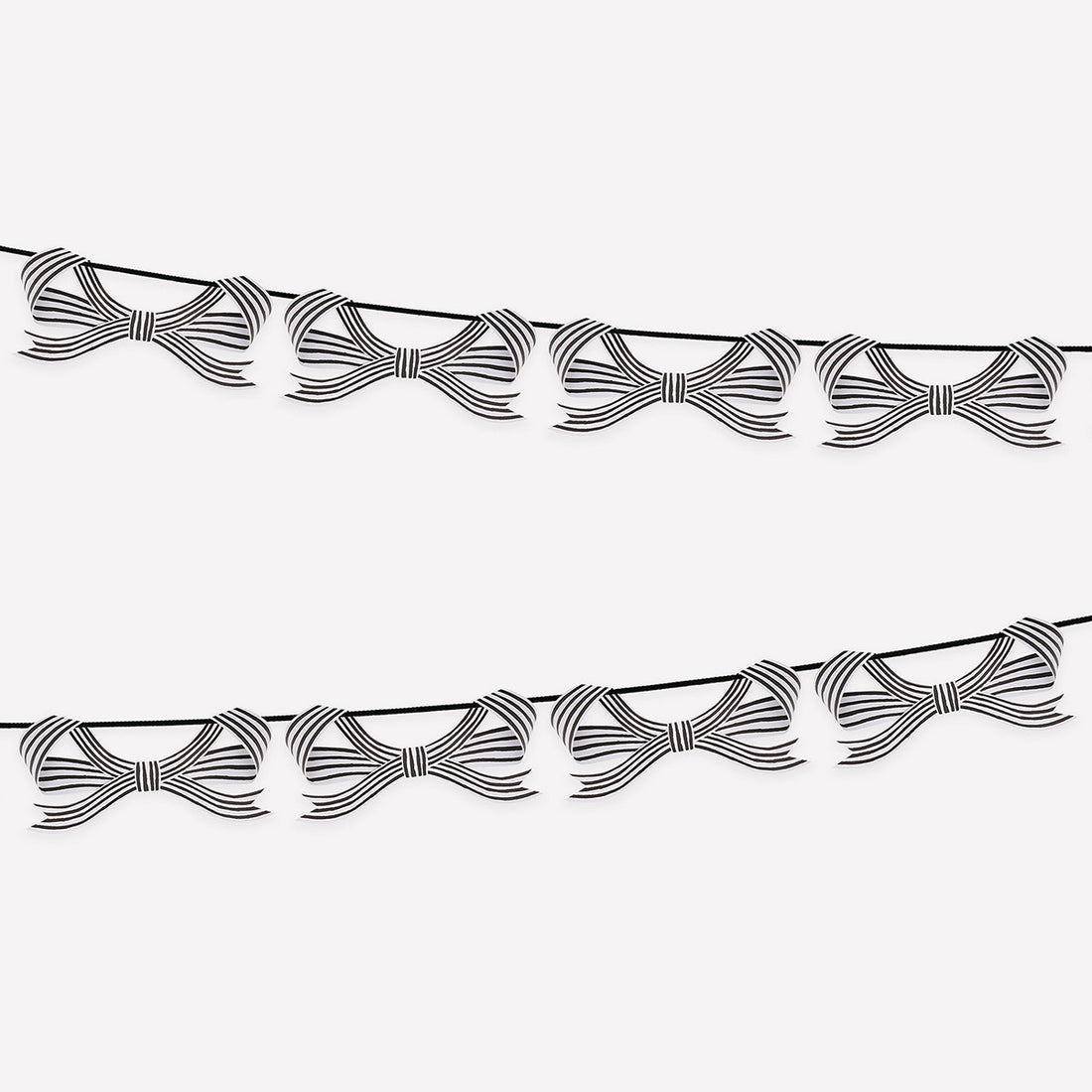Decorative string with black and white stripe bows hung on it on a white background.