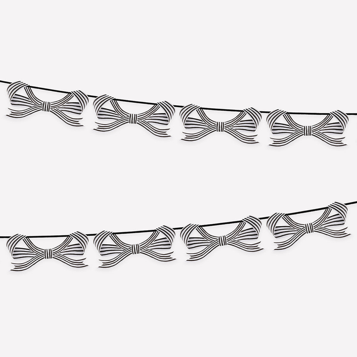 Decorative string with black and white stripe bows hung on it on a white background.