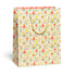Gift bag with a colorful pattern of animals and flowers on a white background.