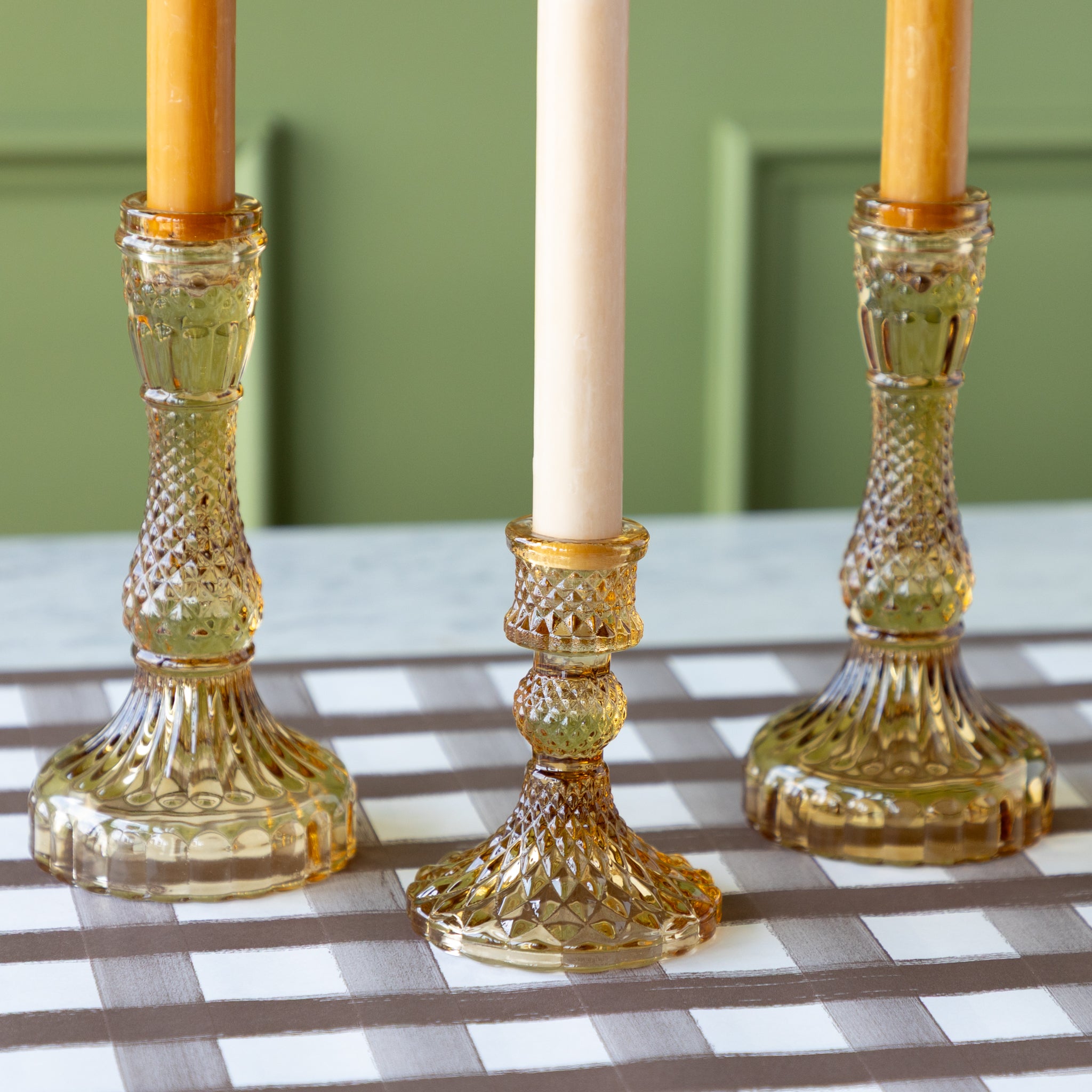 Vintage Amber Candlesticks with amber and cream taper candles on the Brown Painted Check Runner.