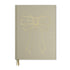 Notebook by Good Juju with gold detailing depicting a bow. 