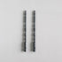 2 taper candles shaped like table spindle legs in slate. 