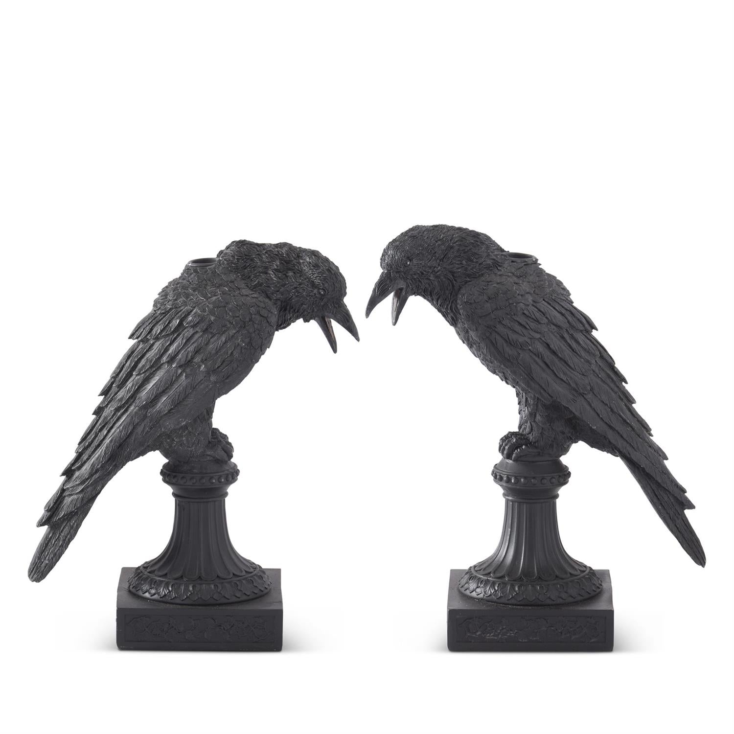 Two Black Resin Crow Taper Candleholders featuring black crows perched on a post with a square base and a spot in their backs for a taper candle.