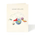 Greeting card with artwork depicting a baby mobile with a world a different planets a rocket ship and a space ship.  Printed above is "welcome to the world". 
