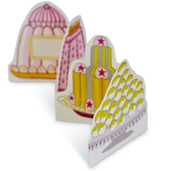 Greeting card with shaped colorful cakes on it that folds accordion style. 