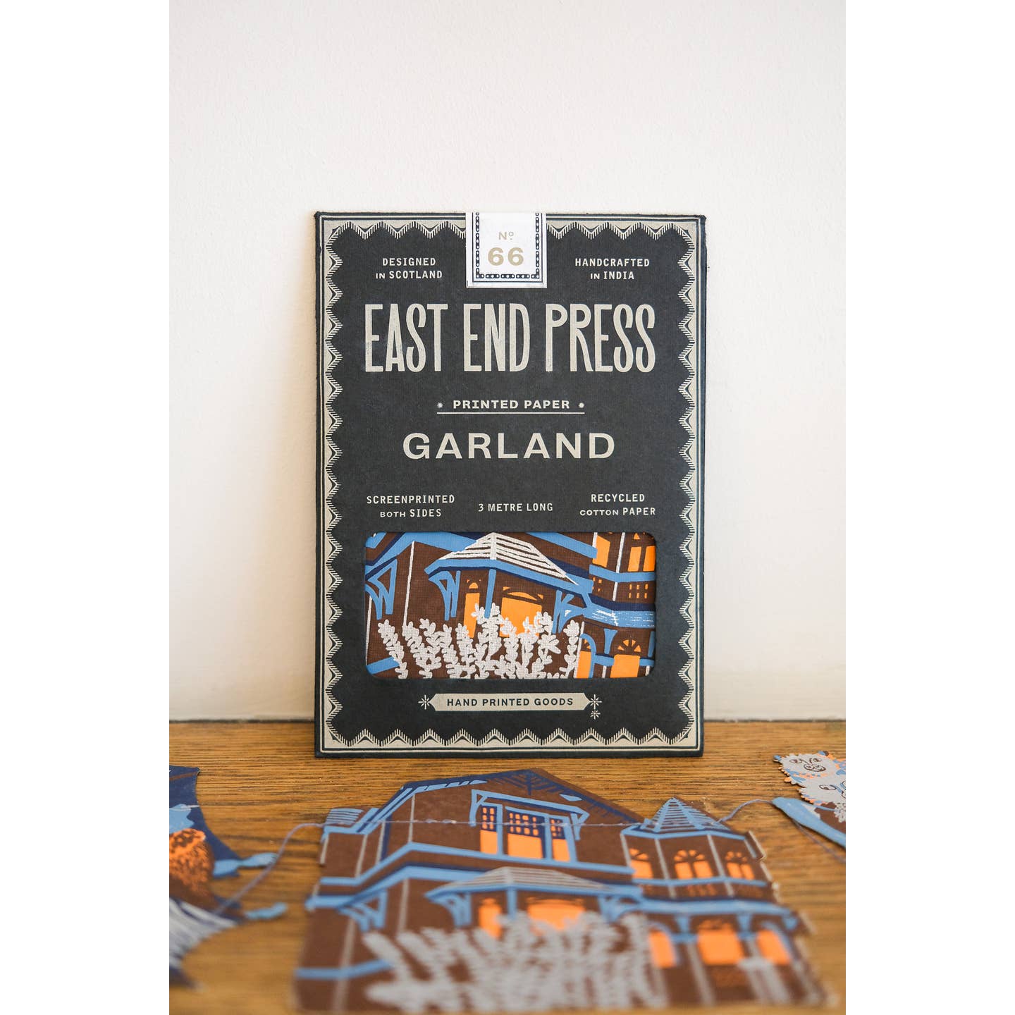 Package of the Haunted House sewn garland on a table surrounded by the garland.