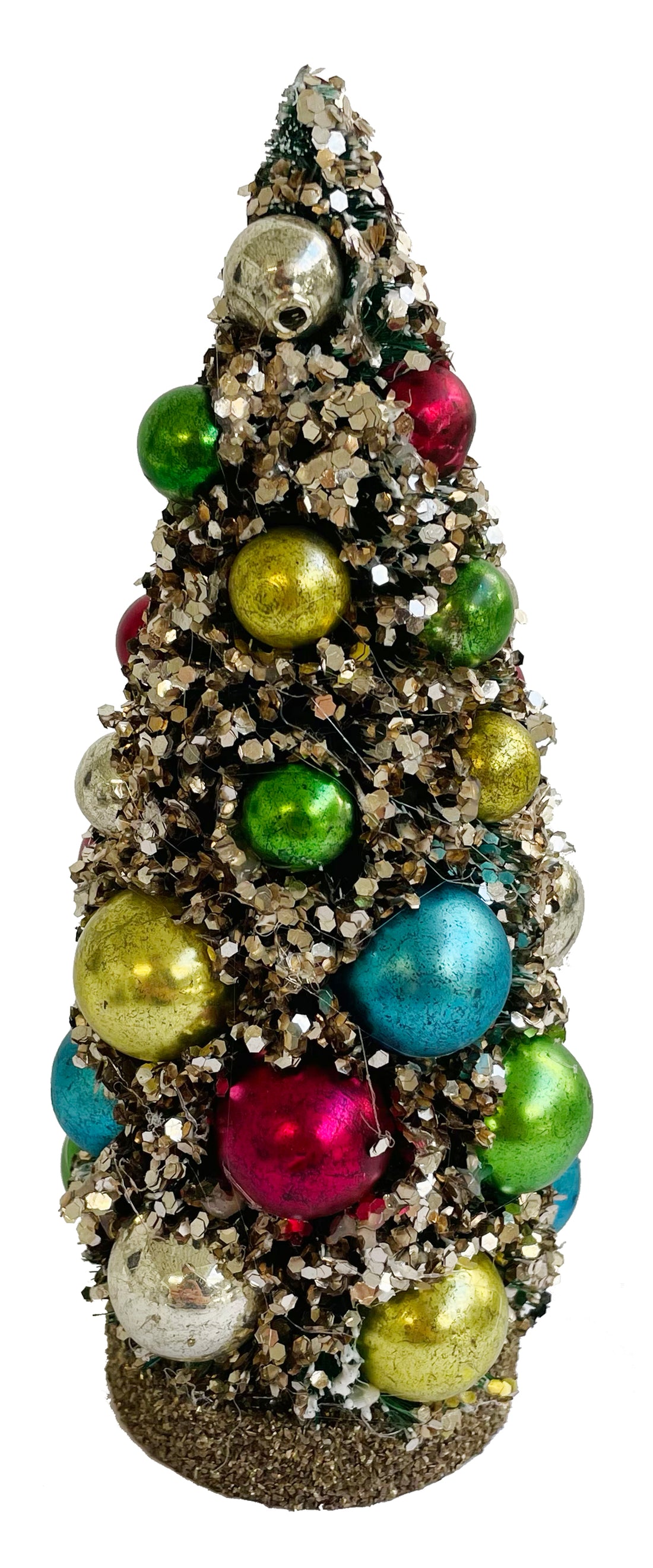 A small decorative silver glitter Christmas tree with multicolored glass balls ornaments.
