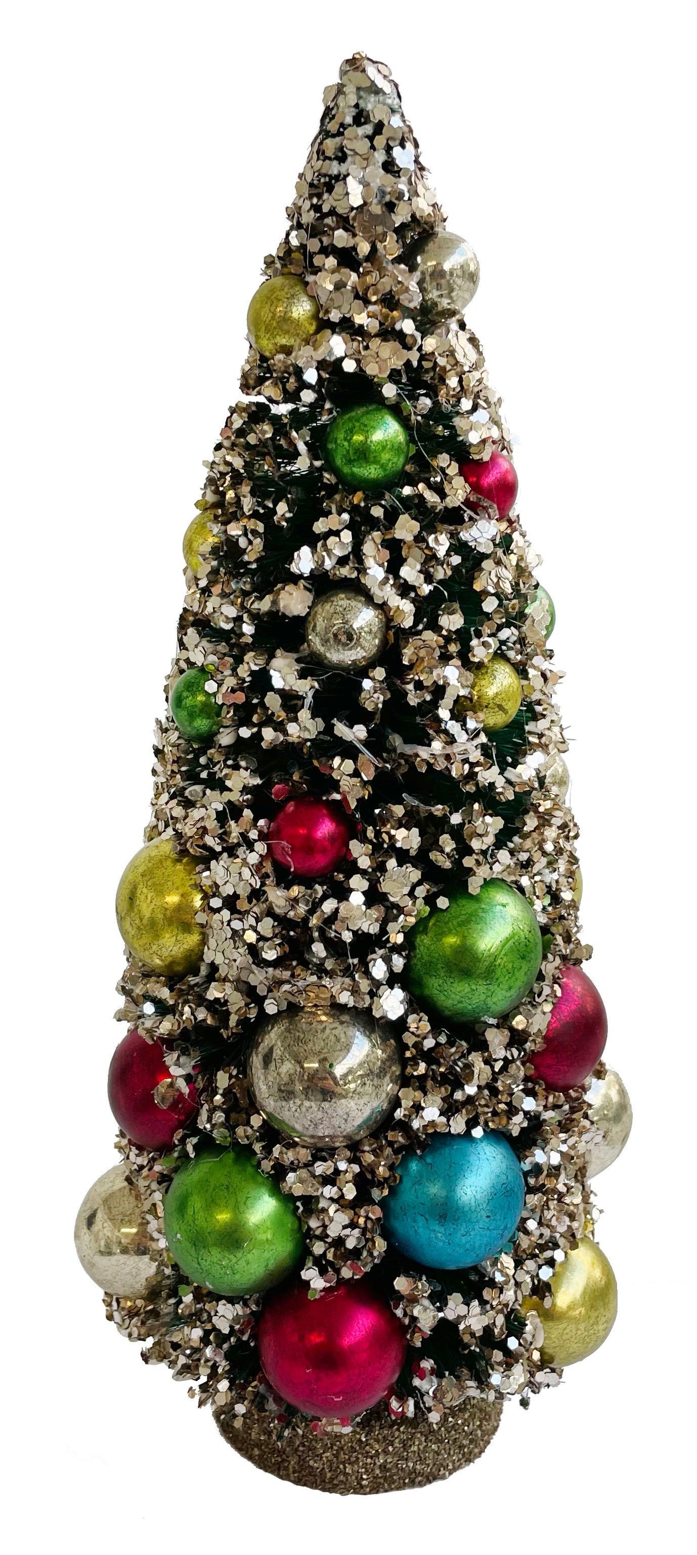 A large decorative silver glitter Christmas tree with multicolored glass balls ornaments.