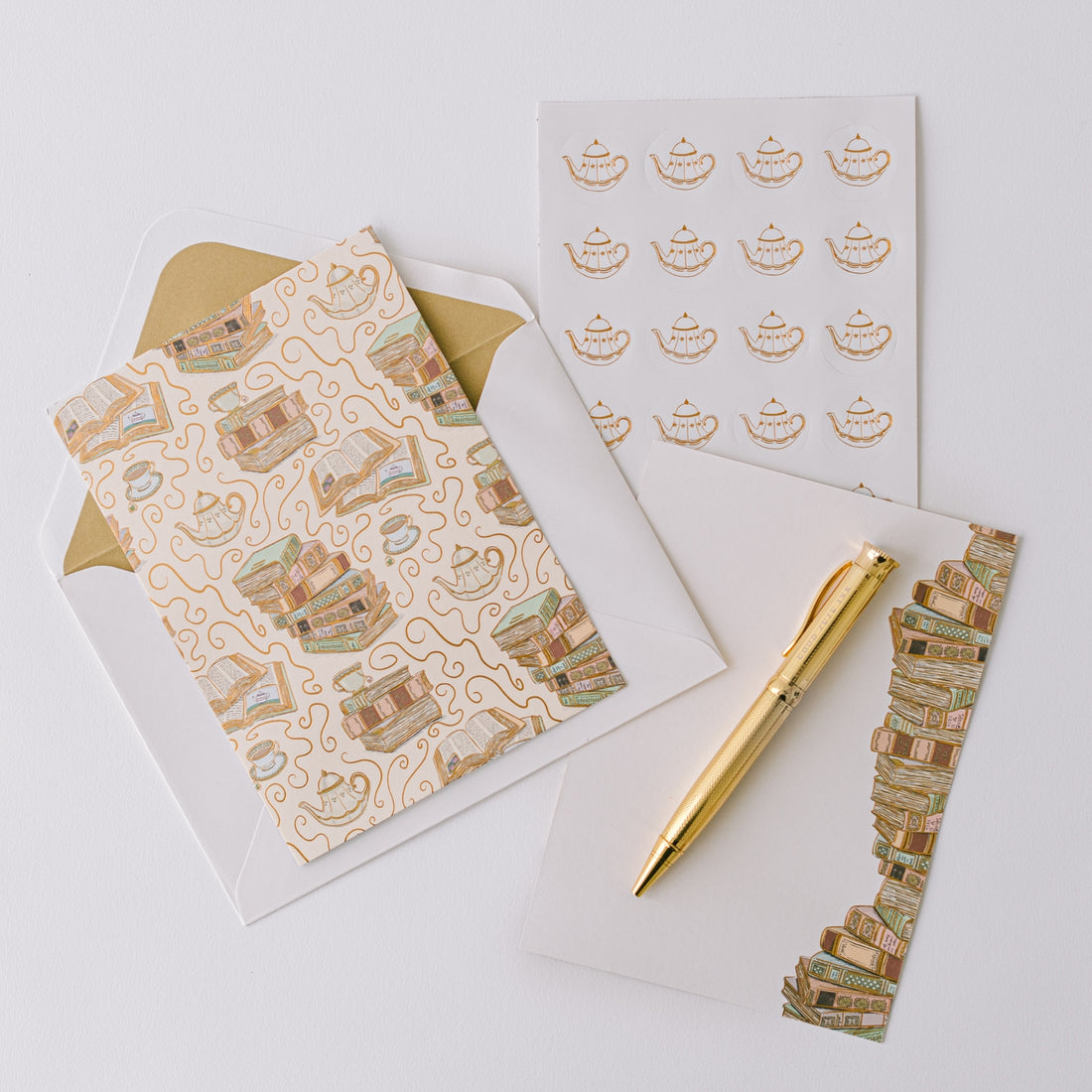 Cozy Book Stack Luxury Stationery Set notecard with stacks of books illustrated on it.
