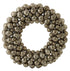 Decorative wreath made of metallic spherical beads on a white background
