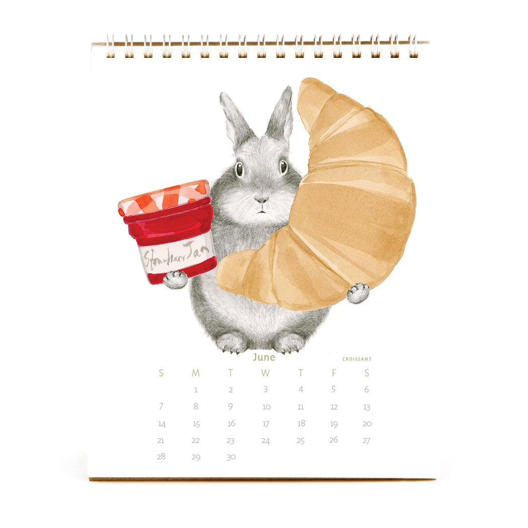 2026 Dear Hancock Bunny Calendar featuring a bunny holding a croissant and a jar of strawberry jam.