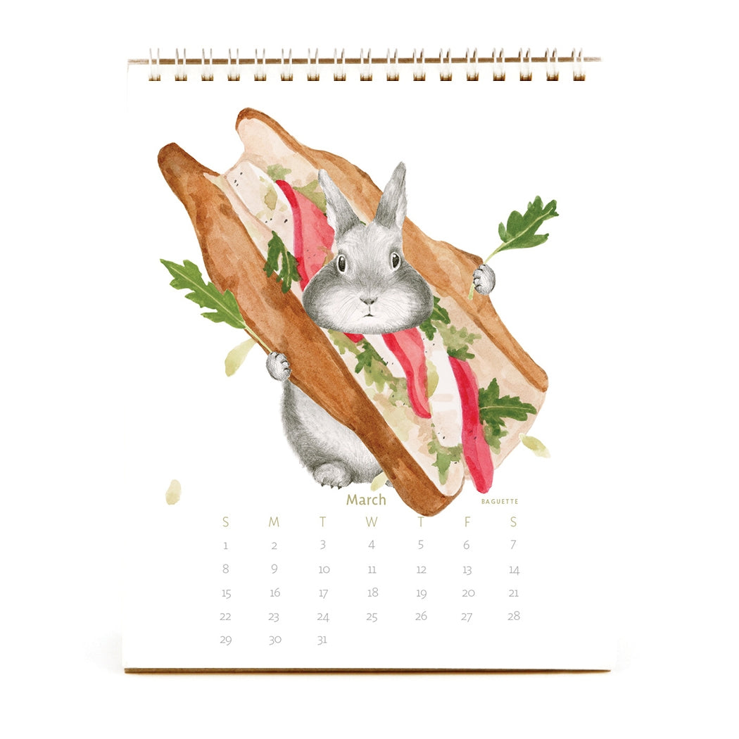 2026 Dear Hancock Bunny Calendar featuring a bunny hiding in a caprese sandwich.
