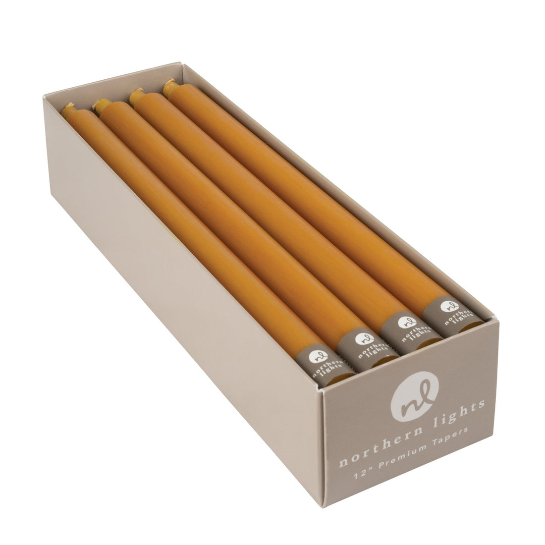A box of caramel colored taper candles by Northern Lights.
