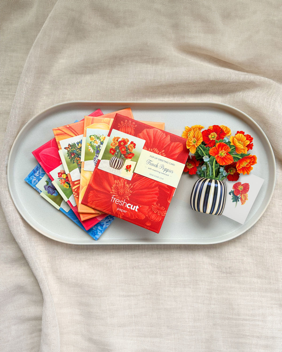 Assorted cards from inside boxed set on tray.