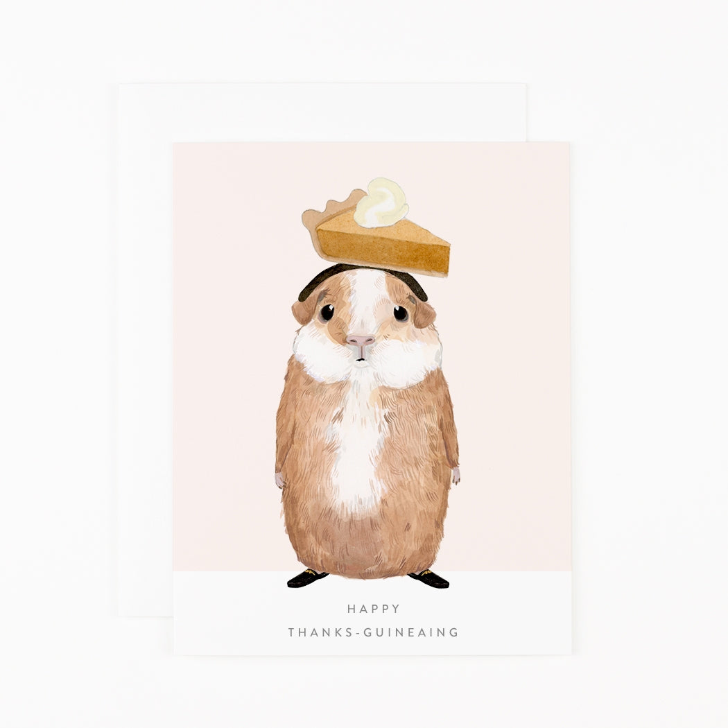 Guinea pig wearing a pie hat with a light bulb on a pink background