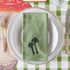 Mushroom-themed place setting with the Embroidered Mushroom Napkin resting on the plates.