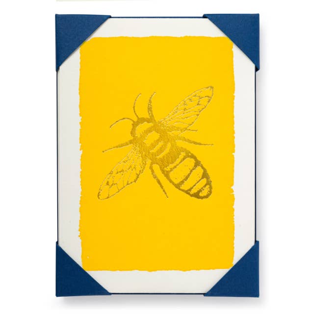 Set of greeting cards with a yellow background and a large gold bee on them.