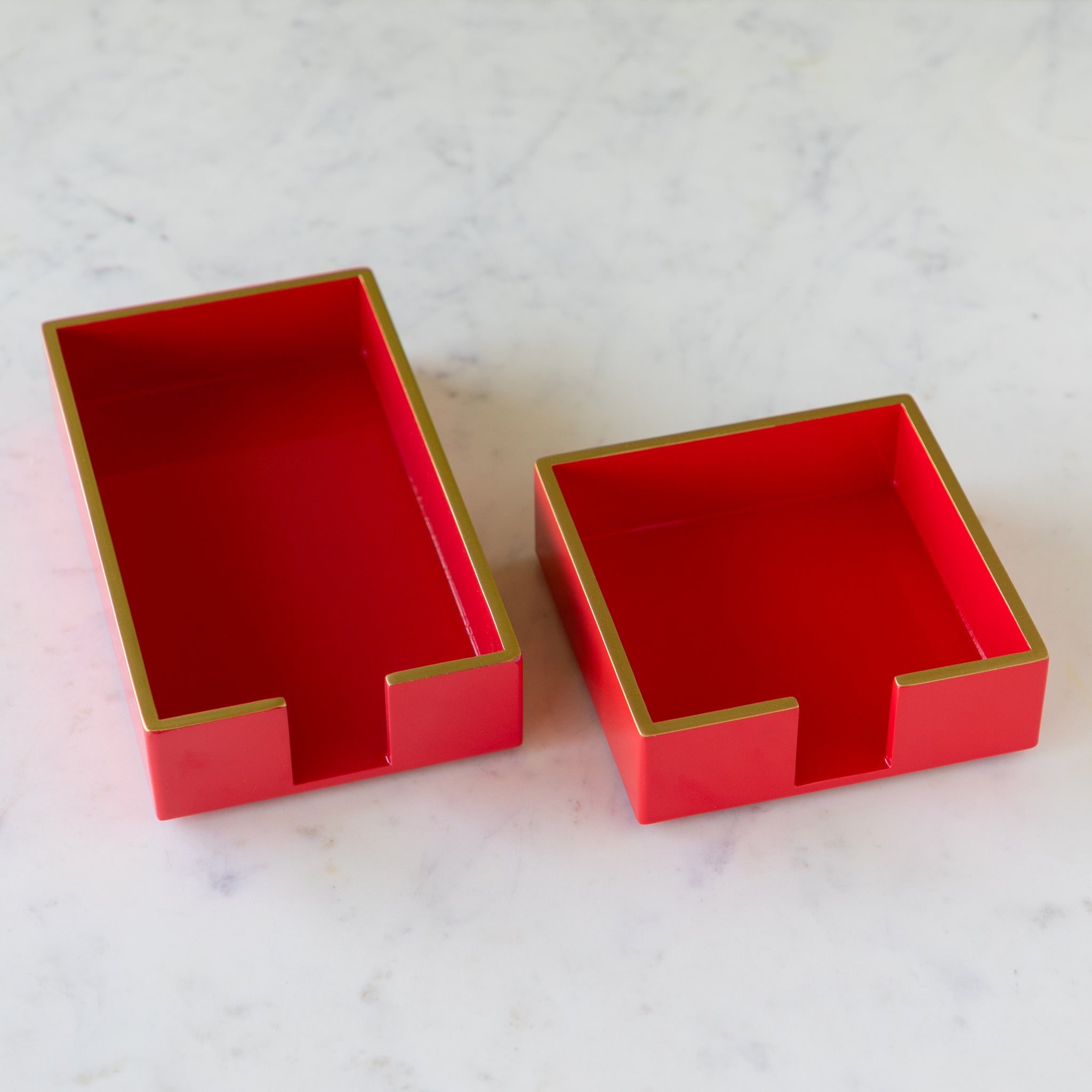 Two Beverage Napkin Holders in red with gold trim in cocktail and a guest size.