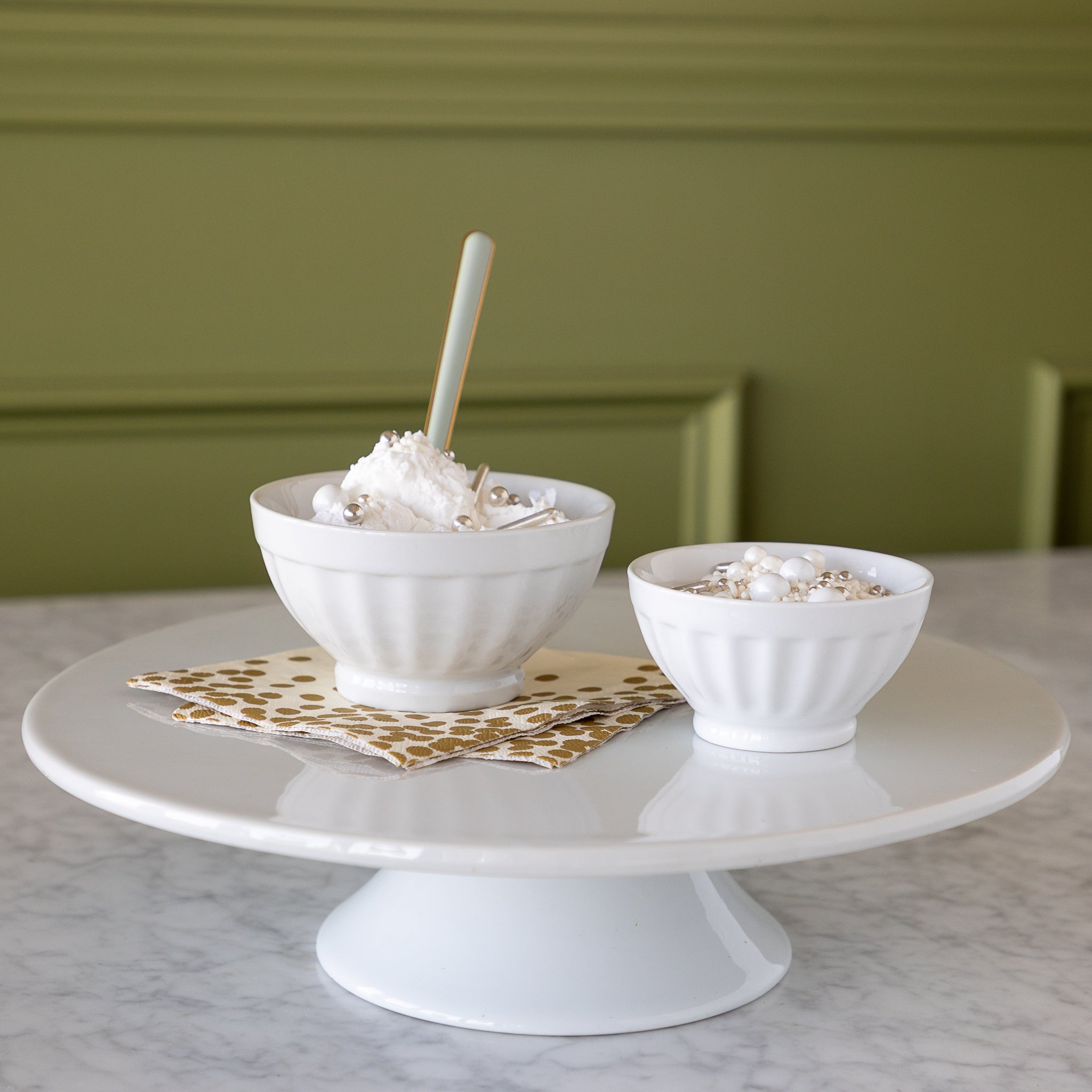 White Fluted Bowl with ice cream in them. 