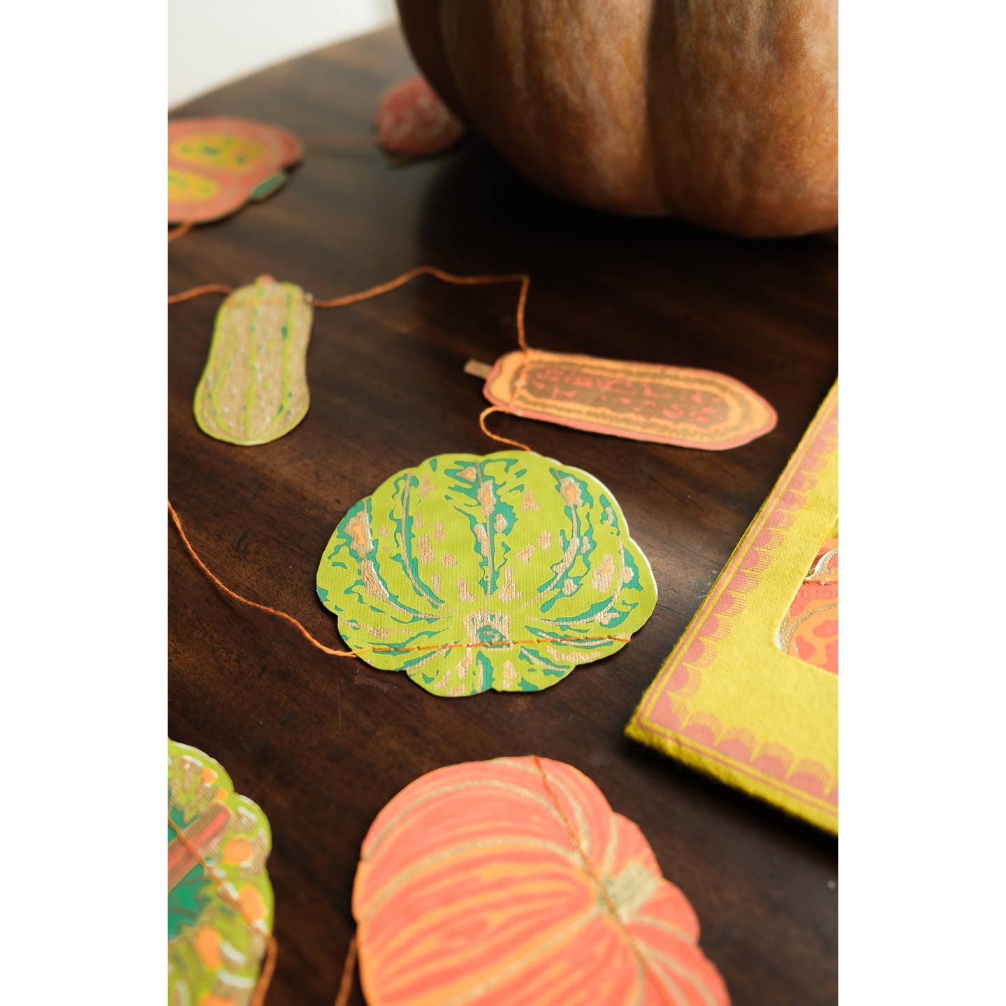 Squashes packaging surrounded by the squashes garland.