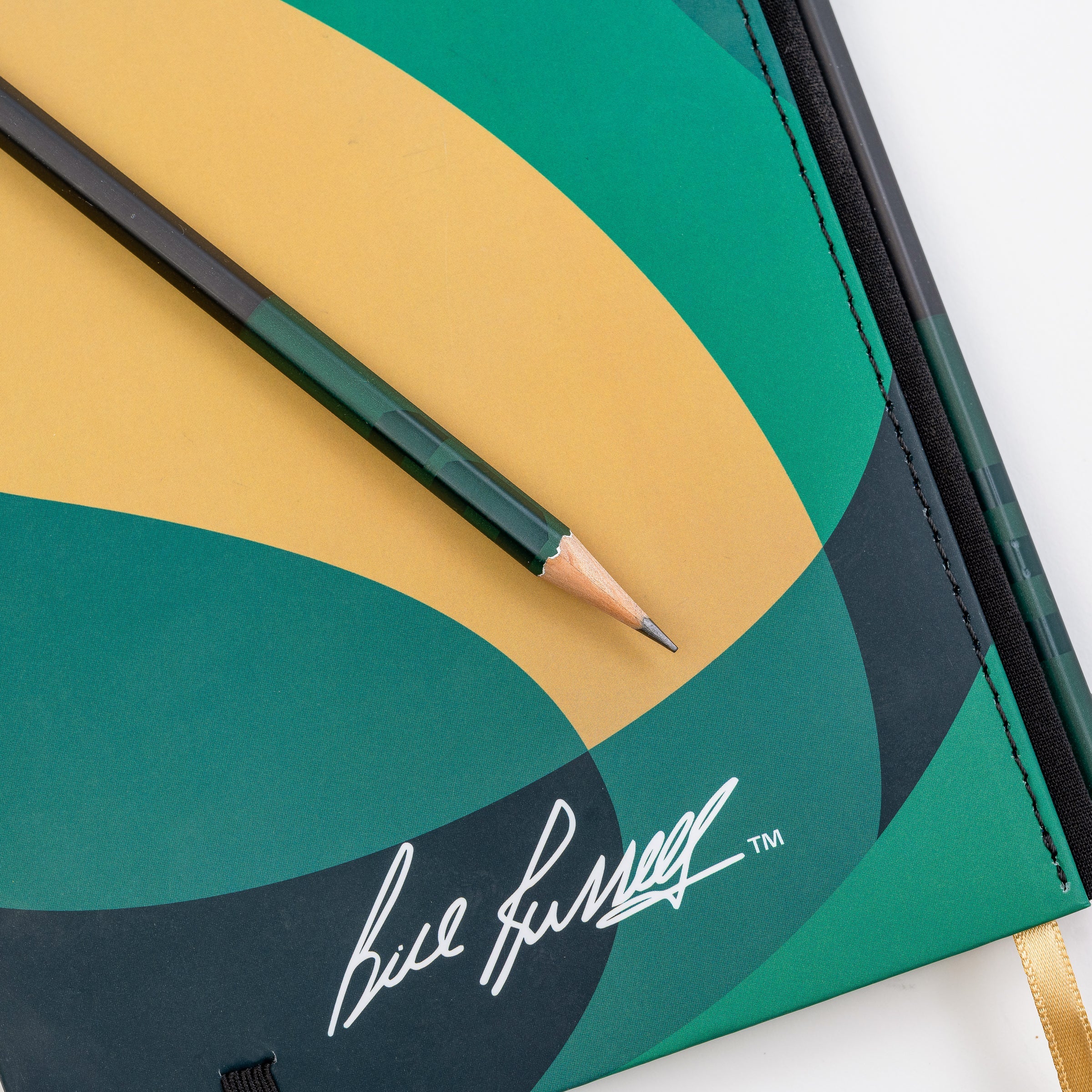 This limited edition Blackwing 11 Slate Notebook features a green, black, and gold basketball inspired cover design and features Bill Russell’s signature printed on the back.