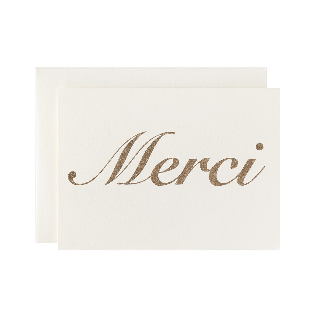 &quot;Merci&quot; in gold leaf against an ivory card with a matching envelope.