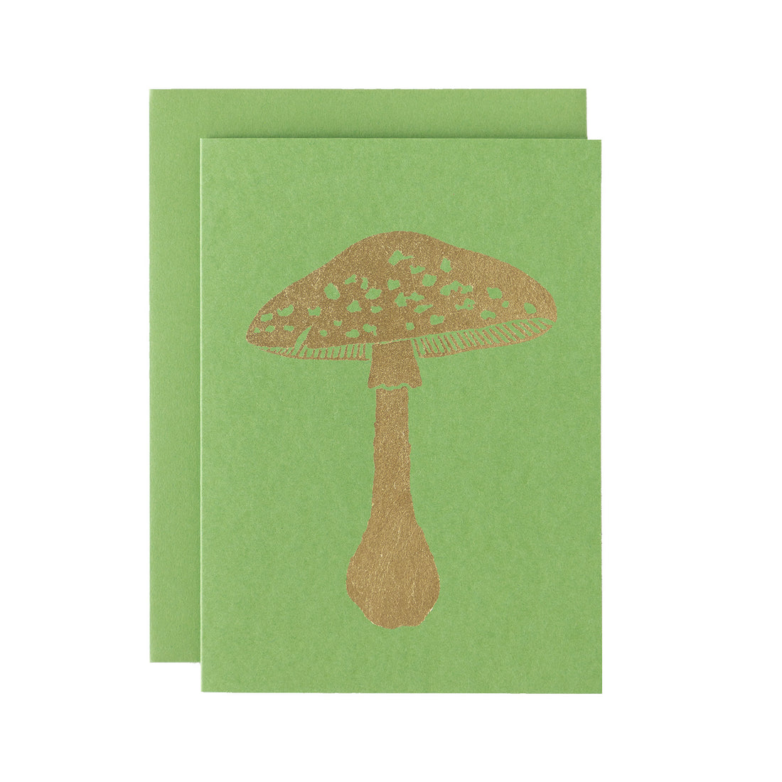 A gold leafed mushroom on a grass green card with a matching envelope.