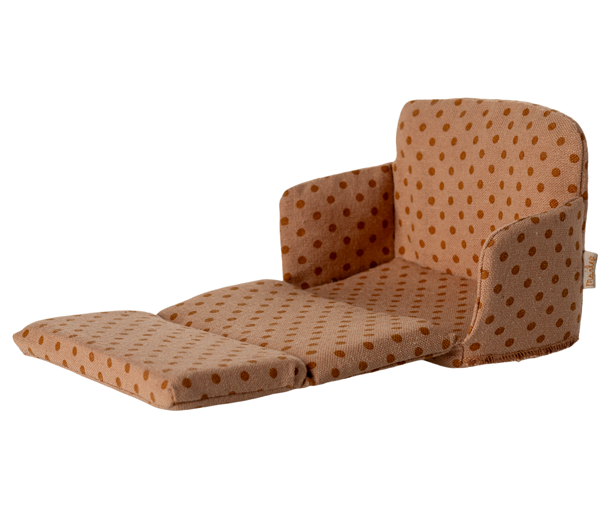 Brown polka dot chair on a white background.