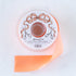 A spool of light-coral satin ribbon with a label featuring illustrated scissors and coral bow, branded "Hester & Cook Fancy Light Coral Ribbon.