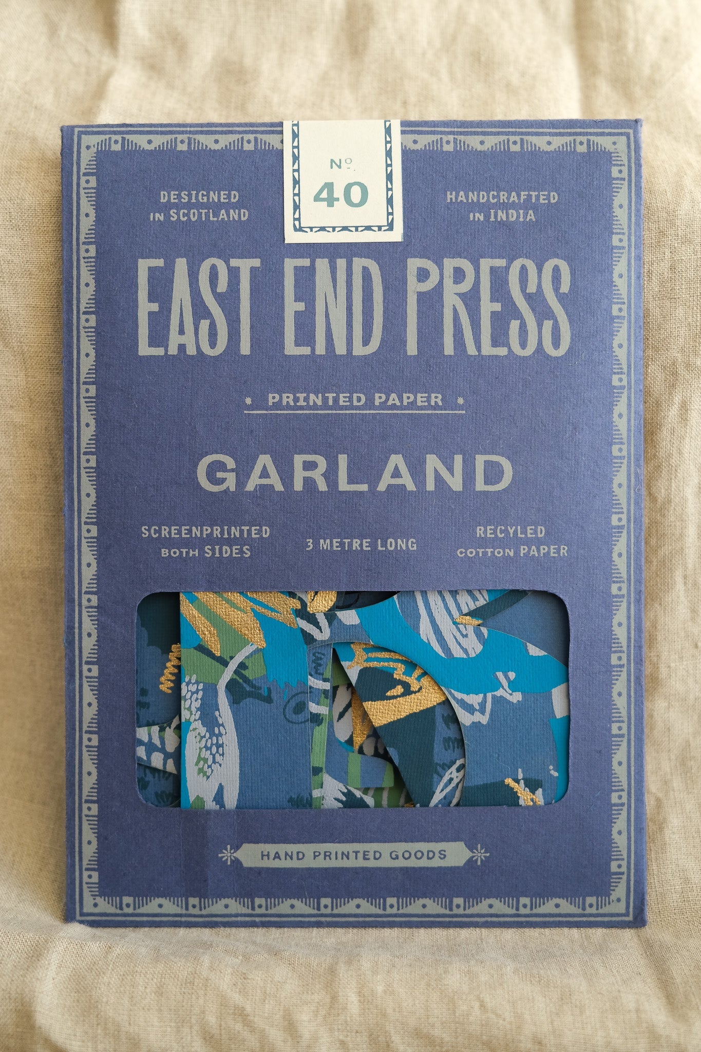 blue Happy Birthday Garland in packaging