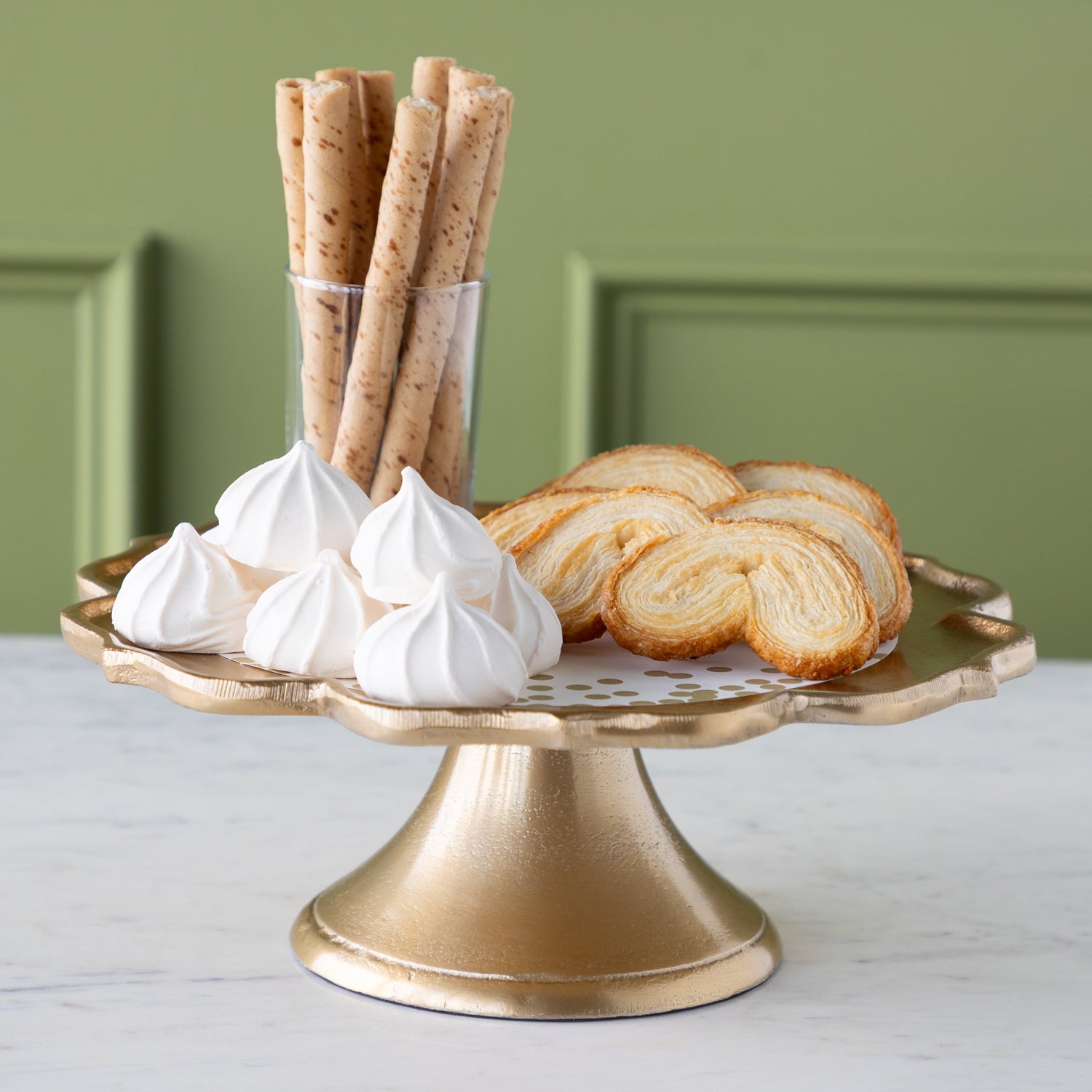 Scalloped Edge Cast Aluminum Cake Plate with the Gold Confetti Serving Paper, palmiers, meringues, and a small cup of wafers atop. 