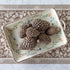 Decorative tray with bronze pinecones on the Brown Regal Peacock Runner.