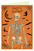 Greeting card with orange background and a skeleton on it saying Greetings for Halloween with bats flying around the skeleton