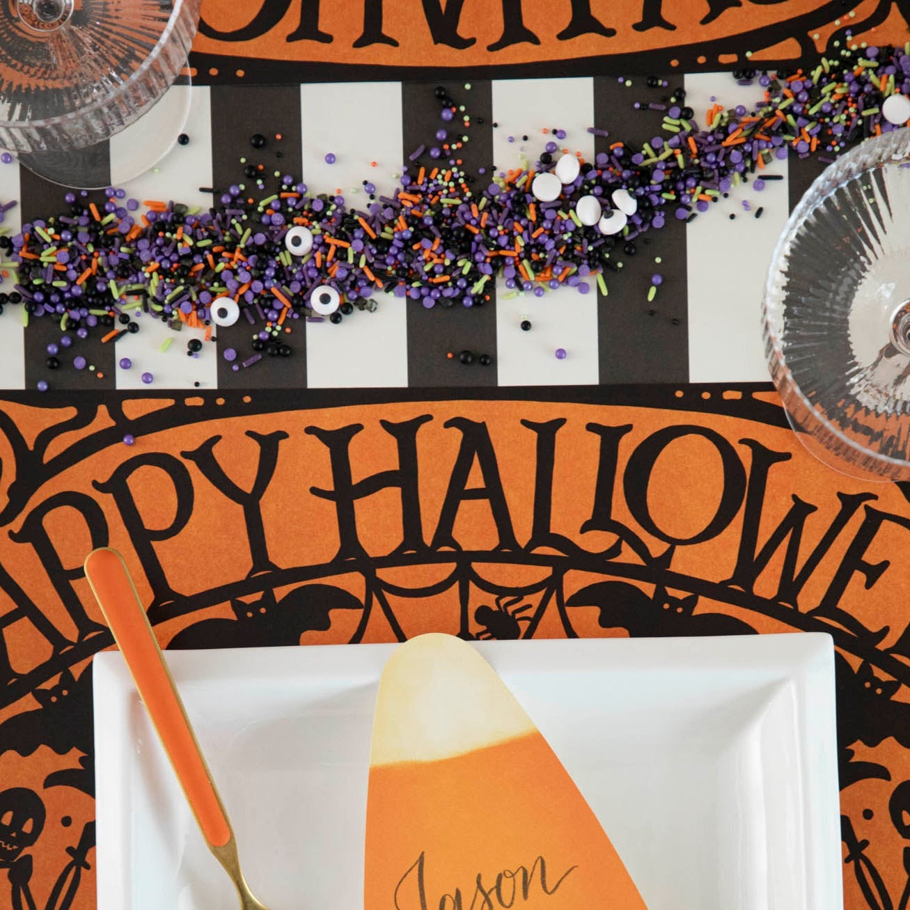 Wicked Halloween Placemat table set up with dinnerware and halloween themed sprinkles
