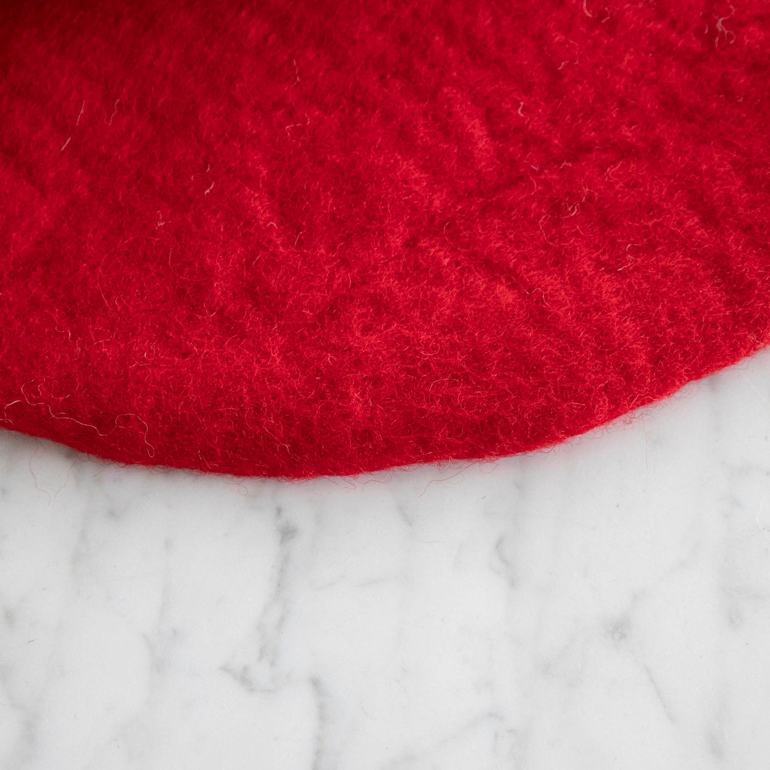 A close up of the Red Felt Placemat showing the handmade details.