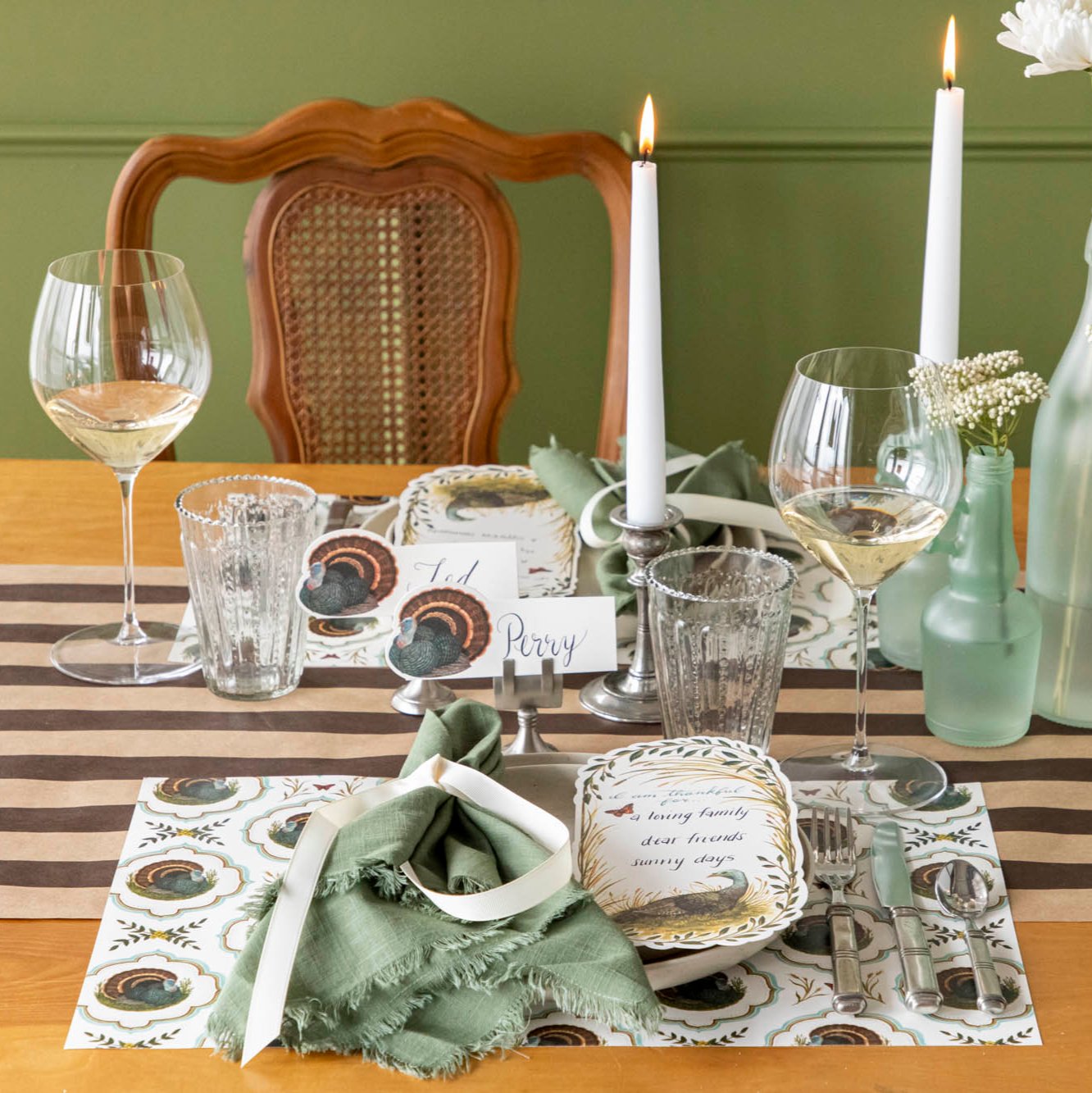 Elegant tablescape with the Heritage Turkey Meadow placemat, dinnerware and candles.