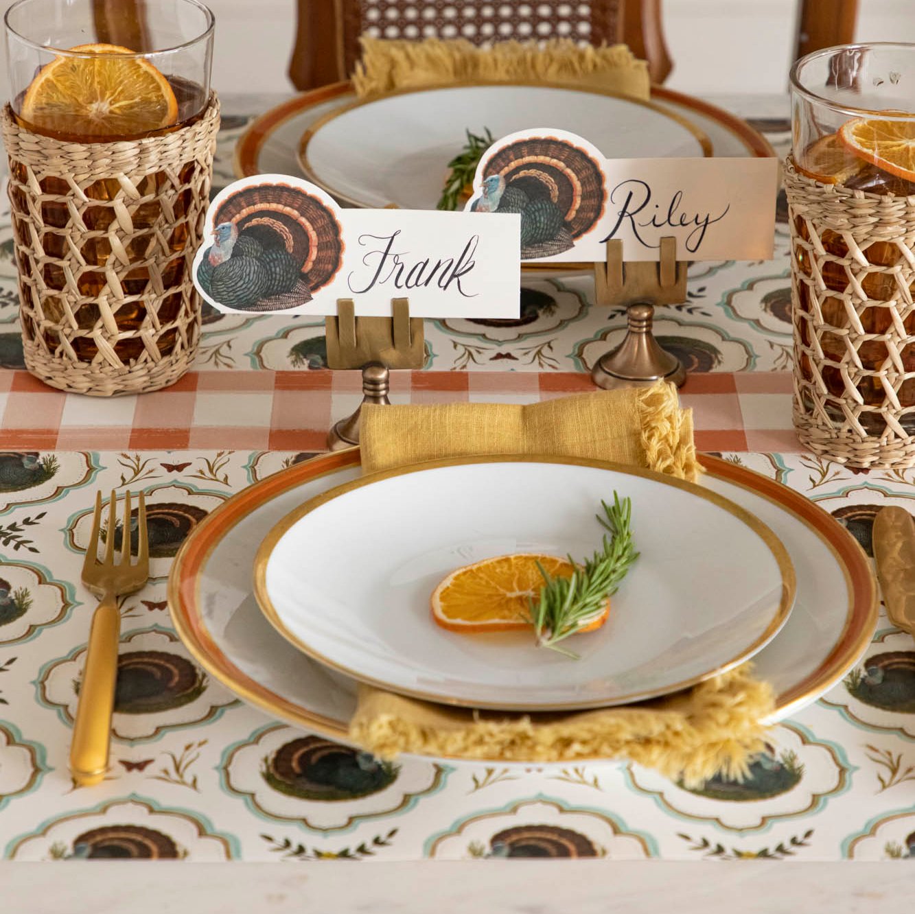 Elegant table setting featuring the Heritage Turkey Meadow placemat with coordinating dinnerware on top.